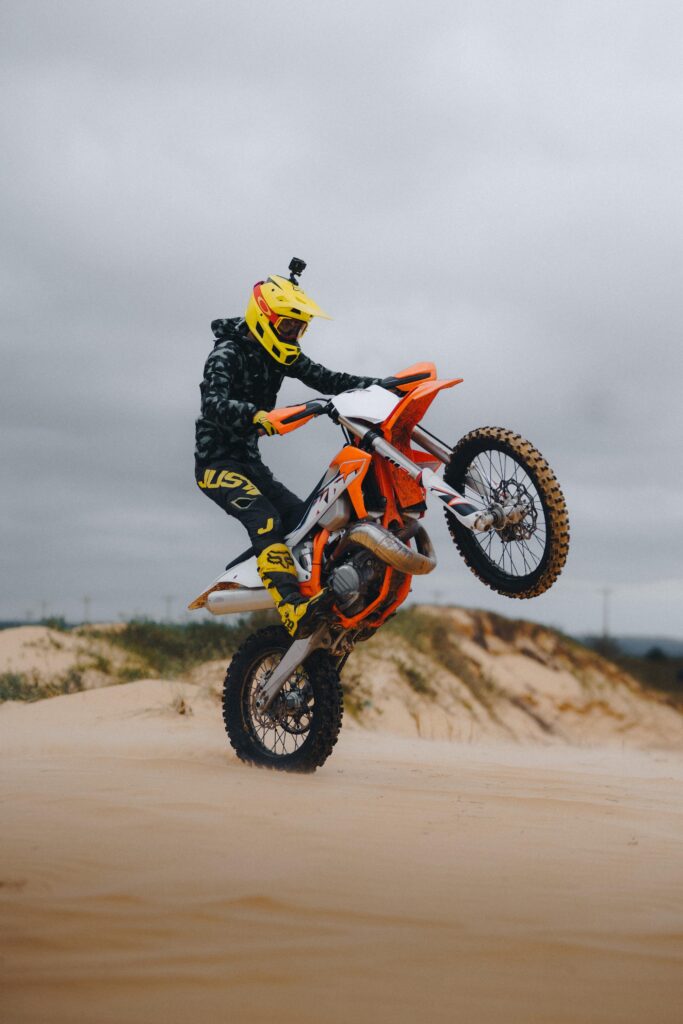motocross physical training orange bike in the air